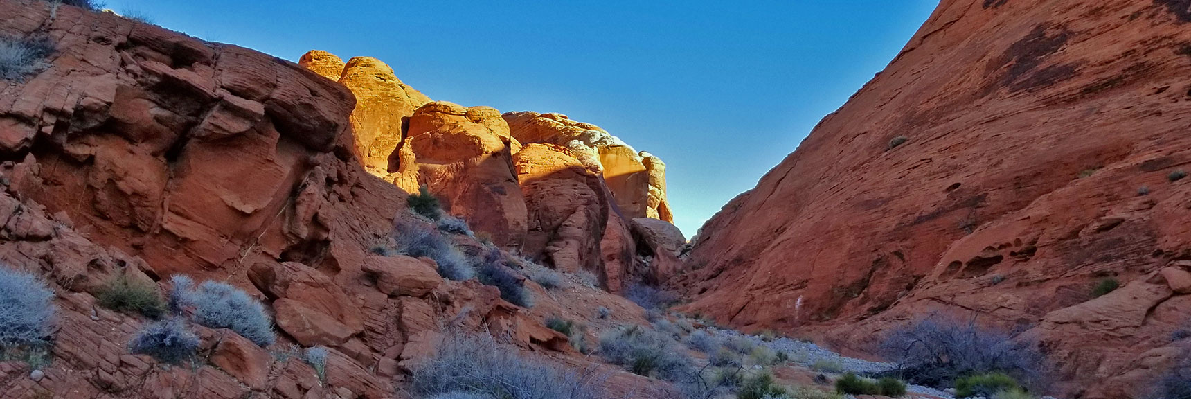 Descending Through the Northern Canyon Wash Toward White Domes on Prospect Trail in Valley of Fire State Park, Nevada