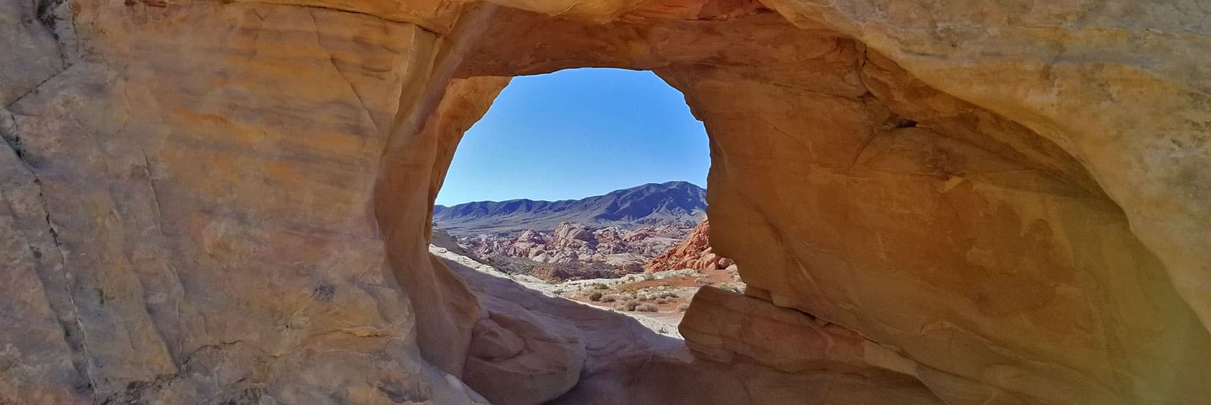 Rock Opening Frames Prospect Trail Area Beyond White Domes Loop Trail in Valley of Fire State Park, Nevada