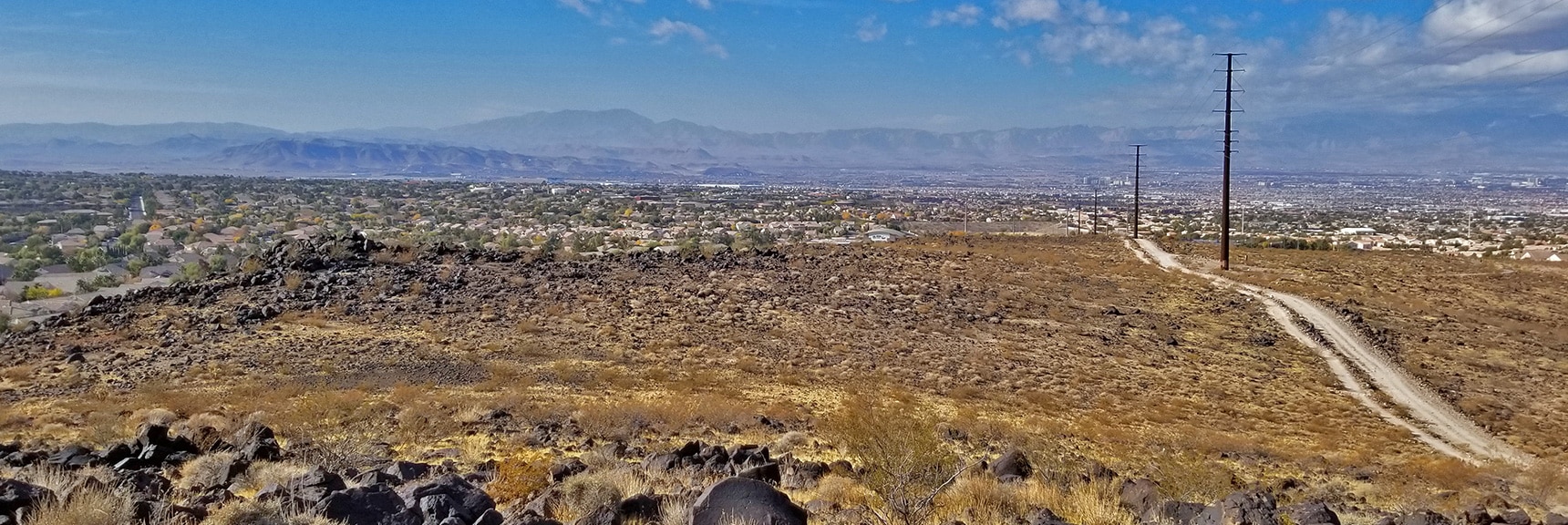 Las Vegas Valley, Potosi Mt. and Rainbow Mountains Viewed from Above Anthem| McCullough Hills Trail in Sloan Canyon National Conservation Area, Nevada
