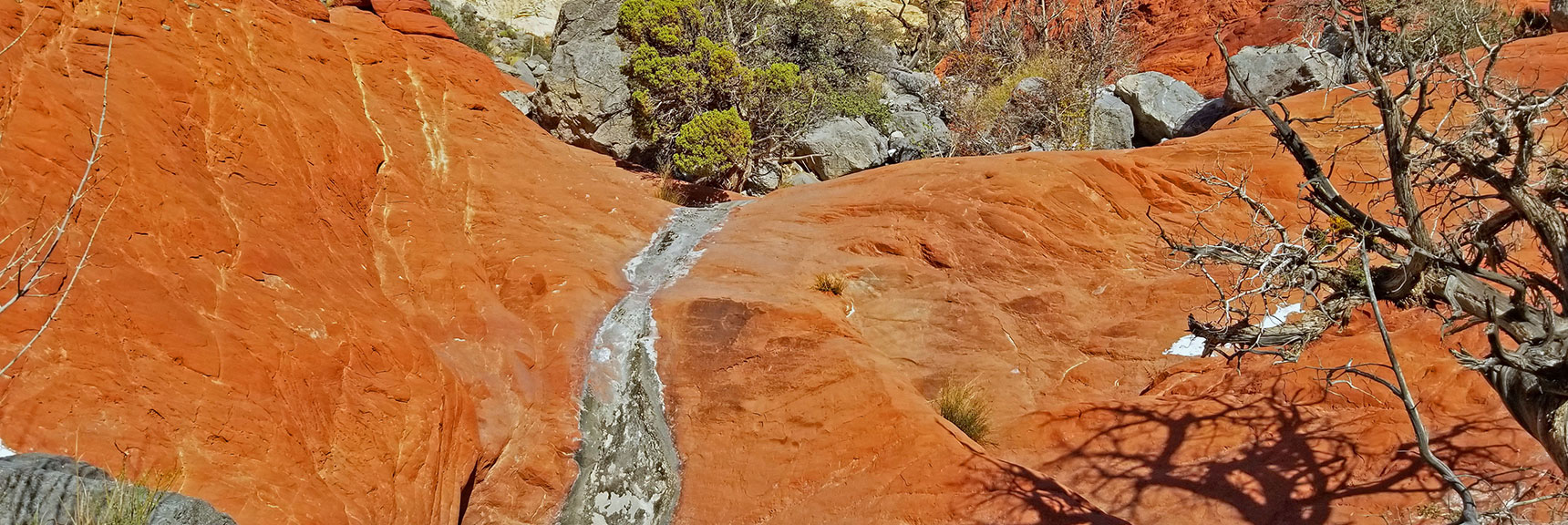 Emerging from Gateway Canyon, Jurassic Red Rock Frozen Dunes Appear. | Kraft Mountain, Gateway Canyon Loop, Calico Basin, Nevada