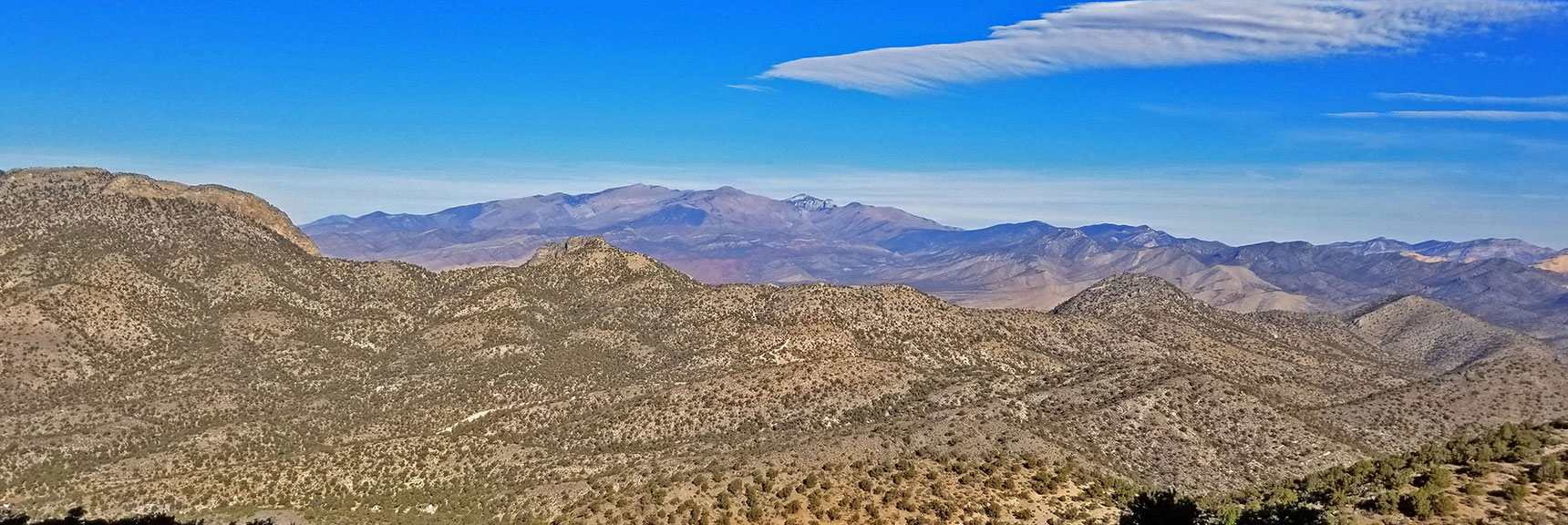 View Back Down Approach Ridge. Potosi Canyon Road Faintly Seen | Potosi Mountain Northern Cliffs Trail | Spring Mountains, Nevada