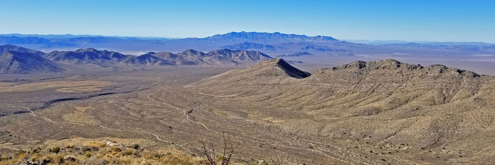 View West Toward the Distant Nopah Range Wilderness and Mesquite Mountains | Potosi Mt. Summit via Western Cliffs Ridgeline, Spring Mountains, Nevada