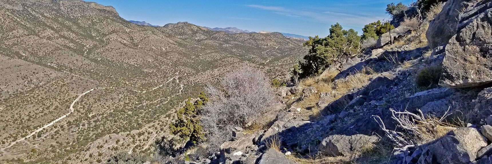 Navigating Around the First Bluff's Headwall, View Down to Mt. Potosi Canyon Rd | Potosi Mt. Summit via Western Cliffs Ridgeline, Spring Mountains, Nevada