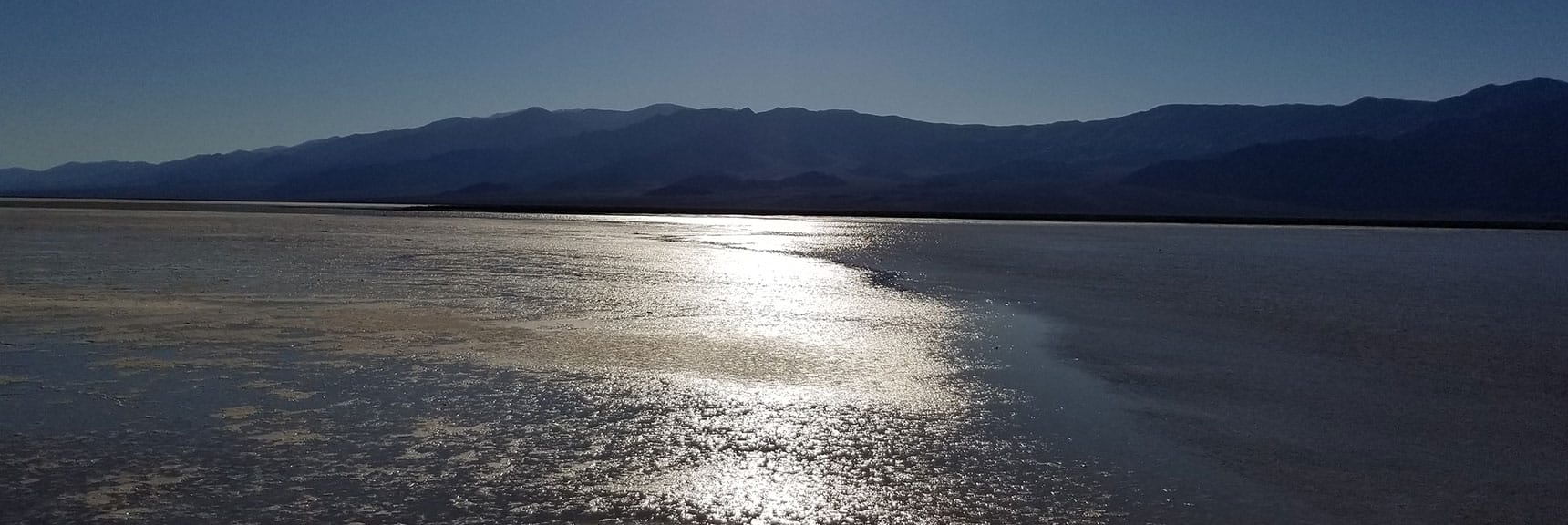 Looking Across the Lake Toward Telescope Peak and the Reflecting Sun. | Return of Lake Manly (Lake in Death Valley) | Death Valley National Park, California
