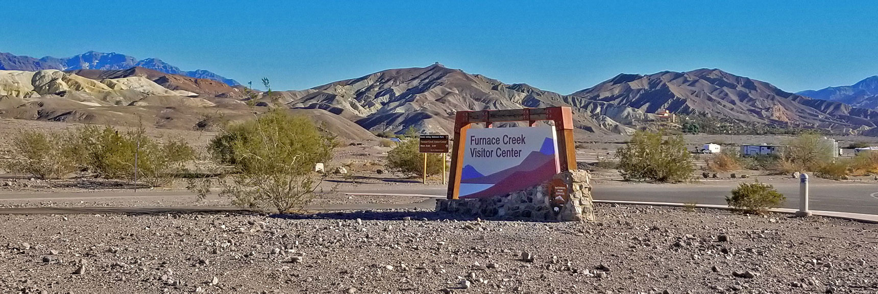 Tea House Seen from the Furnace Creek Visitor Center (above sign and to left) | Tea House & Table Rock Circuit | Furnace Creek | Death Valley National Park, California