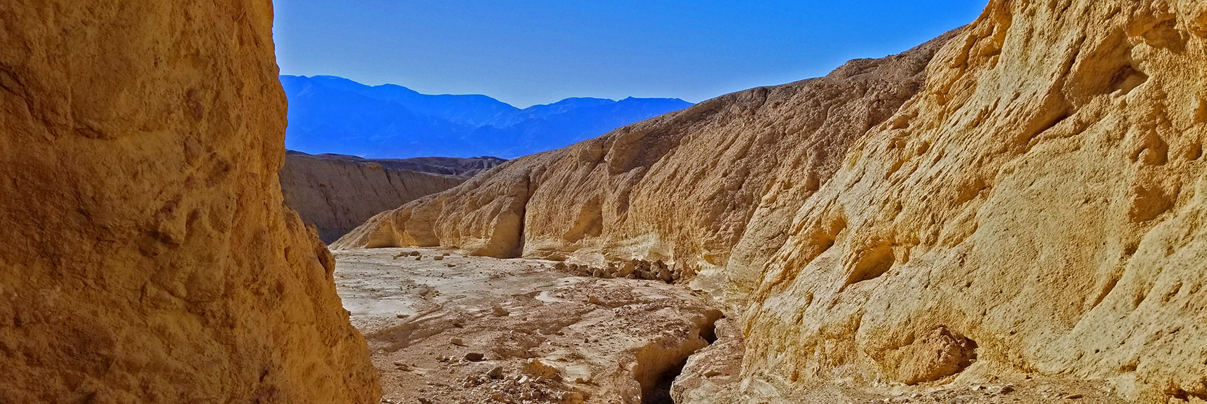 Near the Opening of Artist's Pallet Main Canyon. Panamint Range in View Across Death Valley. | Artists Drive Hidden Canyon Hikes | Death Valley National Park, California