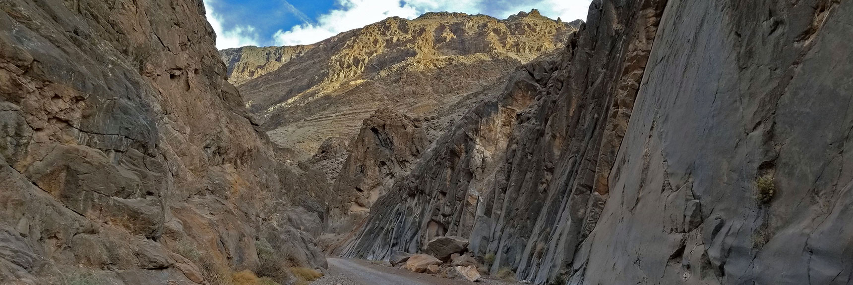 Massive Canyon Walls Rise More Sharply, Polished by Action of Water, | Titus Canyon Grand Loop by Mountain Bike | Death Valley National Park, California