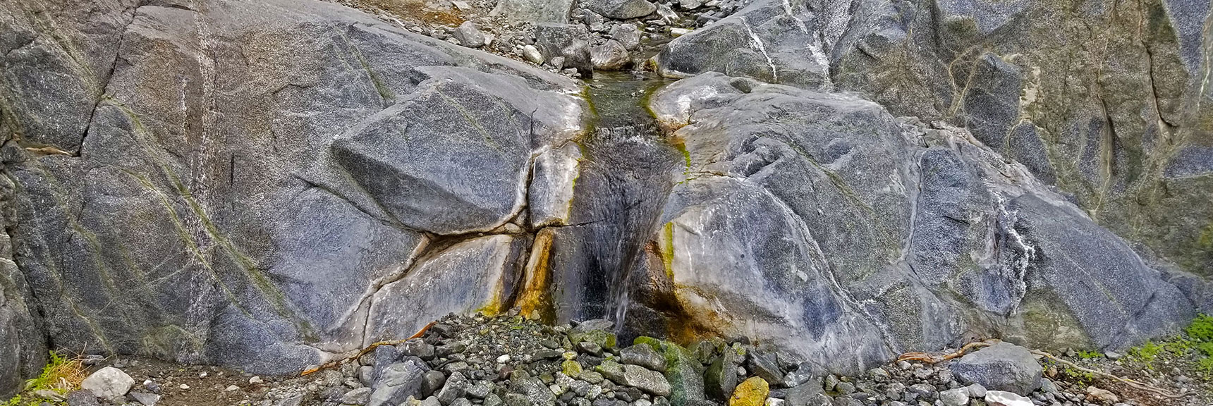 Spring First Appears, Cascading Over Canyon Rocks, Then Diving Under the Gravel Wash.. | Willow Canyon | Death Valley National Park, California