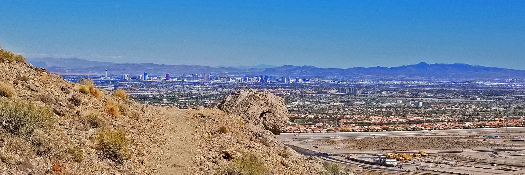 Las Vegas Strip Viewed from Hold Fast Trail. Windy, Clear Afternoon. | Little La Madre Mt, Little El Padre Mt, Little Burnt Peak | Near La Madre Mountains Wilderness, Nevada