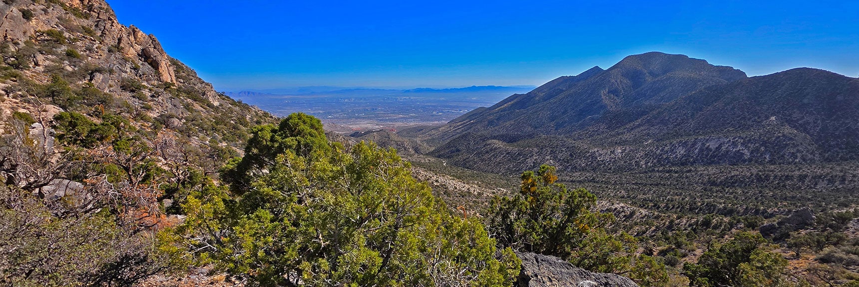 Metro Las Vegas & Little Red Rock Appear Southeast | La Madre Ridgeline East Saddle | La Madre Mountains Wilderness, Nevada