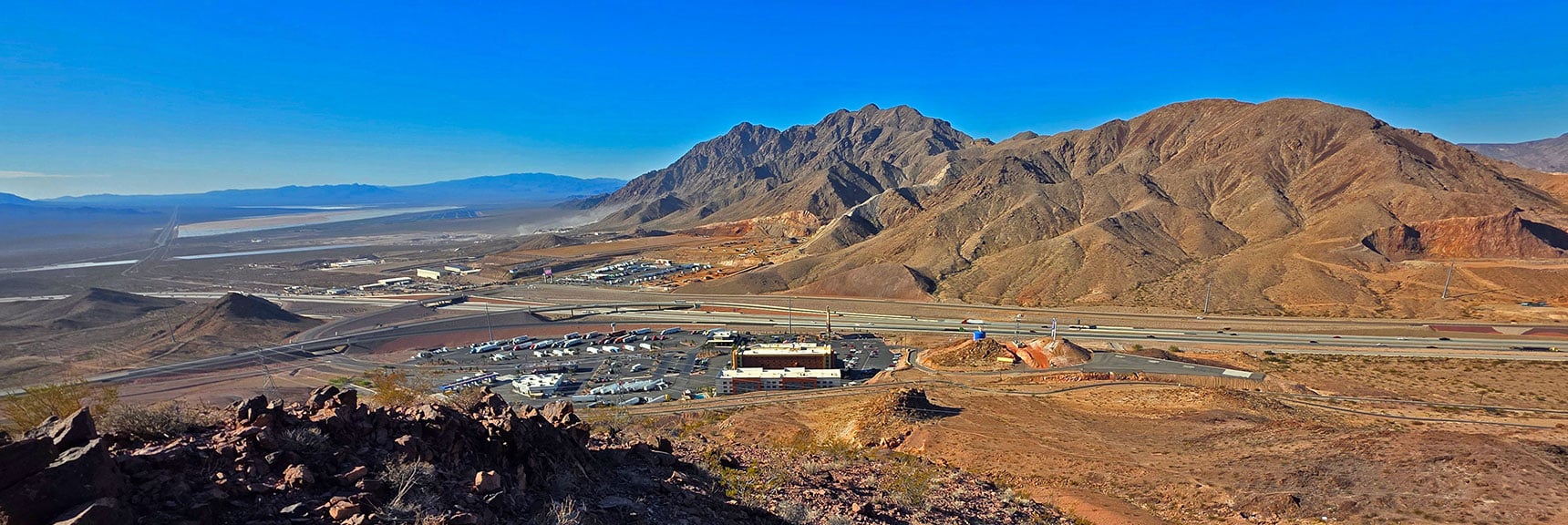 Higher View of Railroad Pass Casino, Truckstop and Railroad Mts. | Leaning Arch Loop | River Mountains | Lake Mead NRA, Nevada