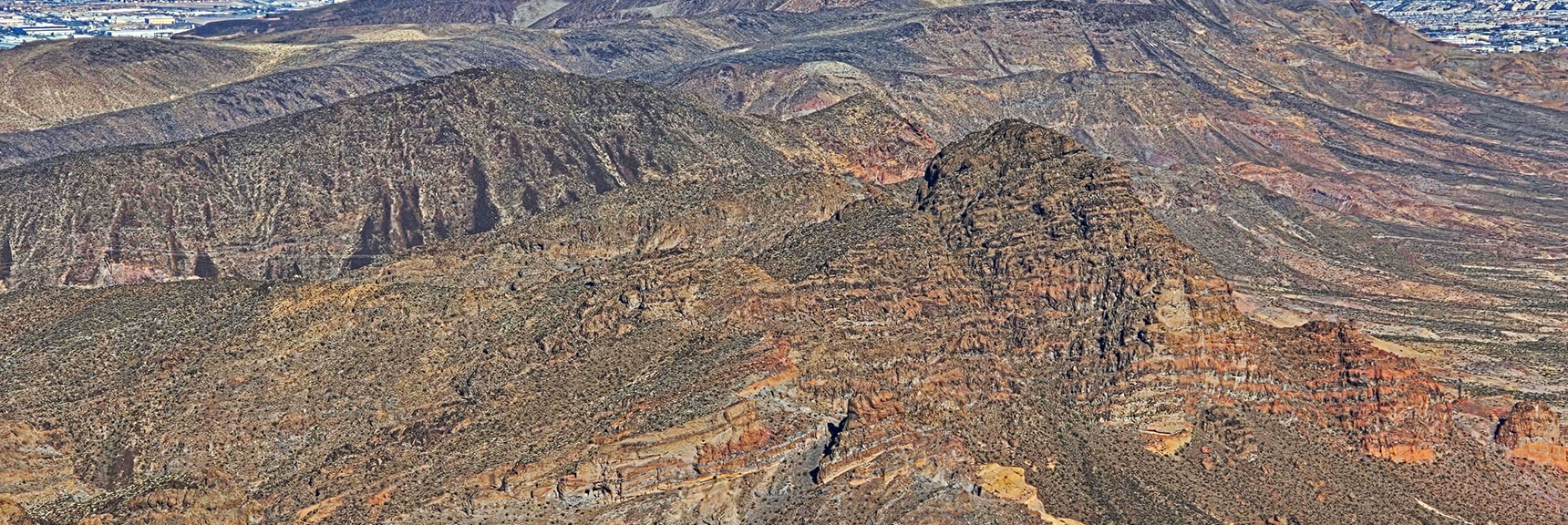 Zoom in on Fortress Peak Guarded by Near Vertical Summit Approach. | Black Mountain North Loop | McCullough Hills | Sloan Canyon National Conservation Area, Nevada