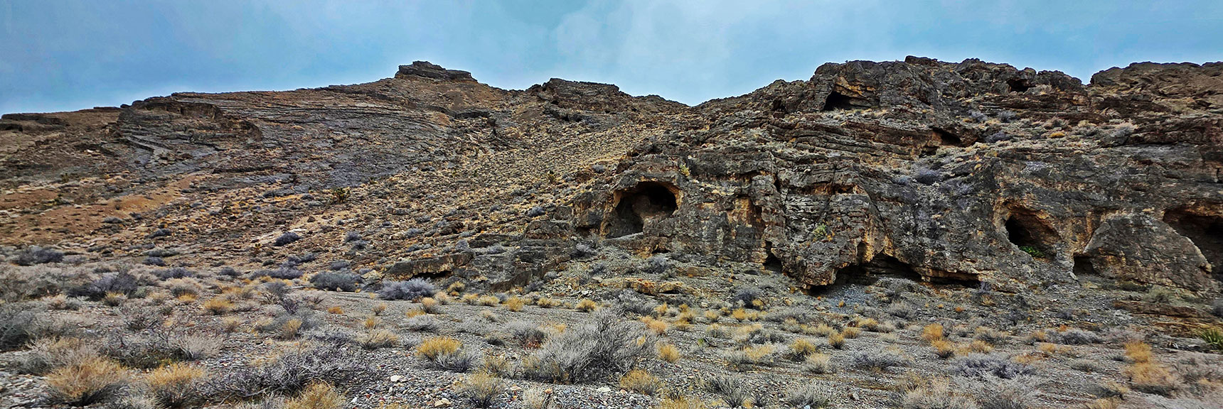 Northwest End of Castle Rock Lined with the Non-Stop Caves. | Castle Rock Loop | Desert National Wildlife Refuge, Nevada