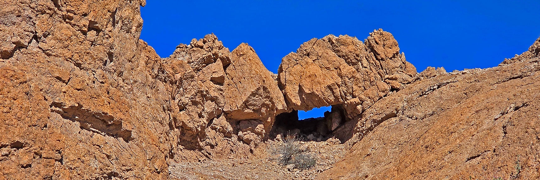 As You Approach Arch Cave Watch for Small, Beautiful Volcanic Arches. | Murl Emery Arch | Eldorado Wilderness, Nevada