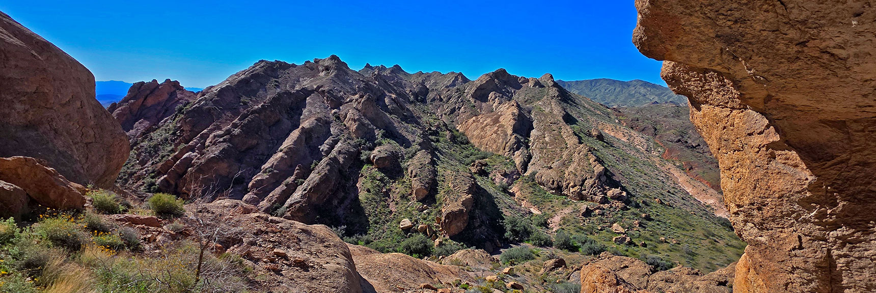 View South While Looking Out Arch Cave Entrance. | Murl Emery Arch | Eldorado Wilderness, Nevada
