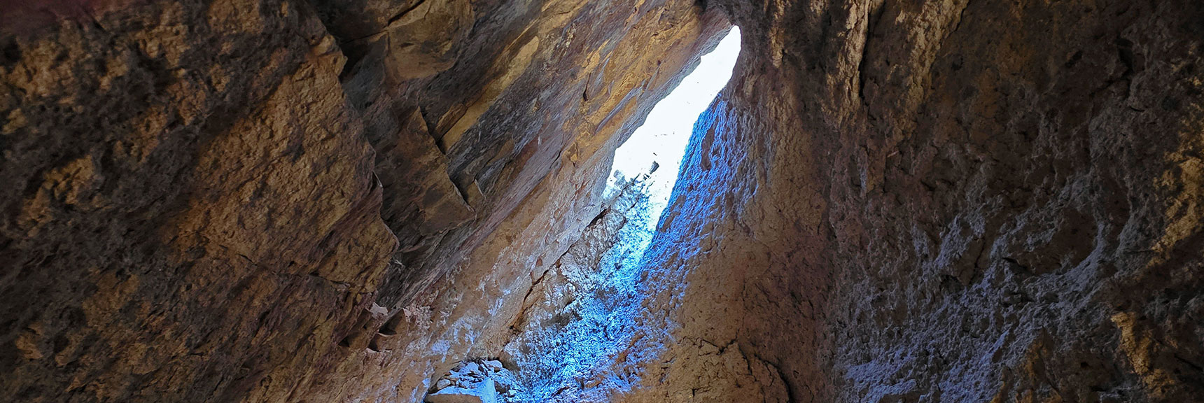 Remove Your Backpack to Ascend Rabbit Hole. Tie Pack to Rope, Pull Up. | Murl Emery Arch | Eldorado Wilderness, Nevada