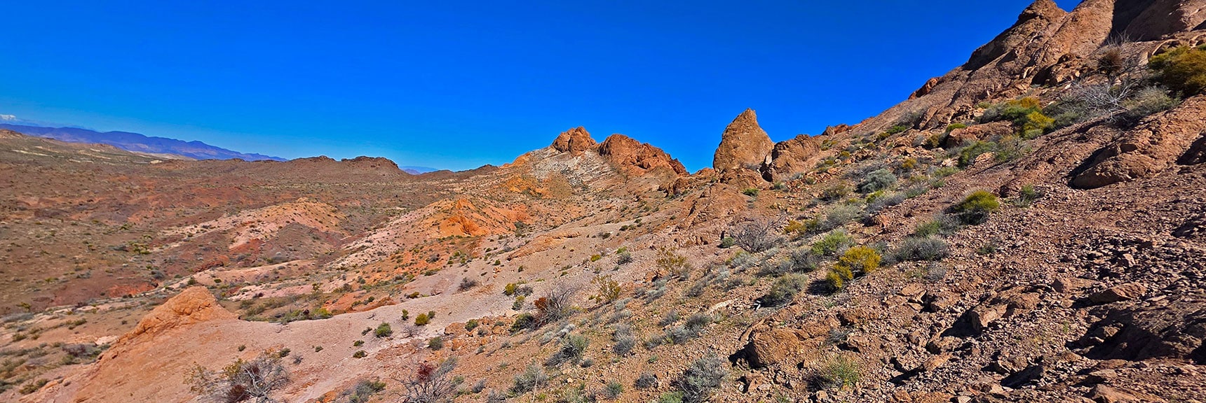 Your Route Will Cross Ridgeline, Circle Left of Pillar to Arrive at Stocker Pass | Murl Emery Arch | Eldorado Wilderness, Nevada