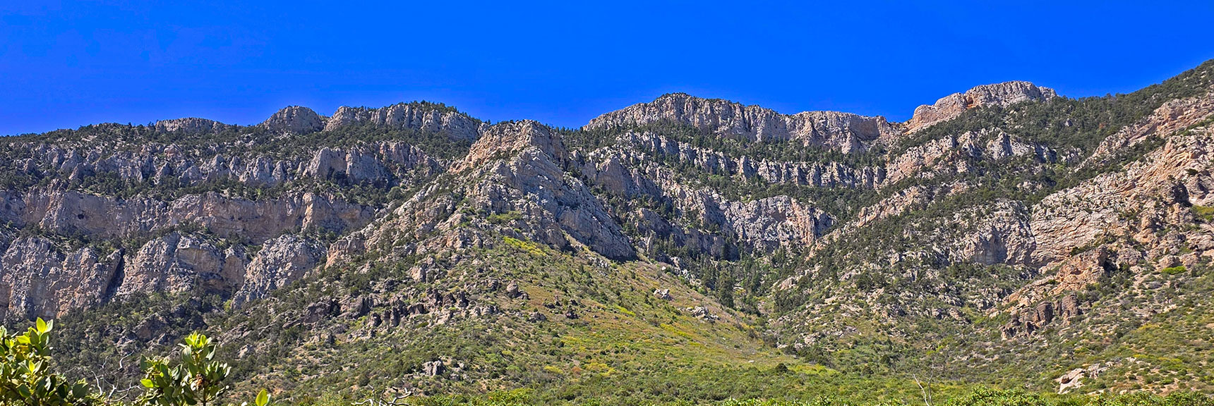 Crash Site is on the Far Side of the Upper Ridgeline Just Below High Cliffs. | Carole Lombard Plane Crash Site | Potosi Mountain, Nevada