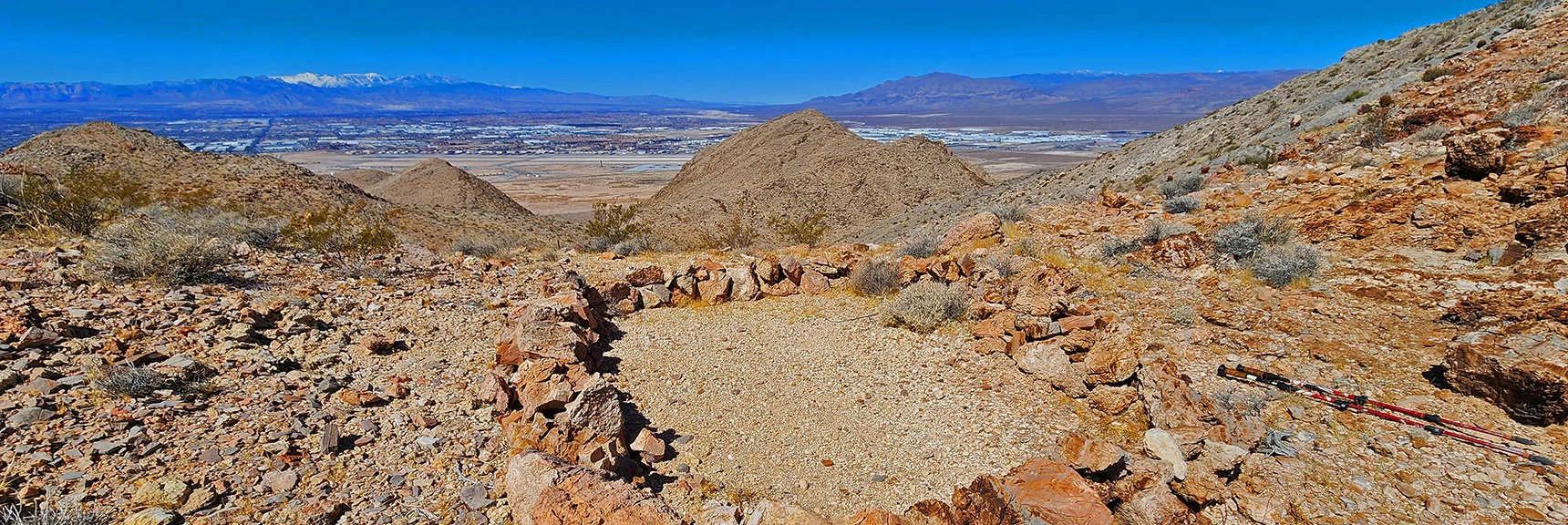 Intervening Saddle Has a Cool Camping Spot. Nellis AFB Background. | Sunrise Mountain Near Lake Mead National Recreation Area | Las Vegas Metro & Surrounding Areas, Nevada