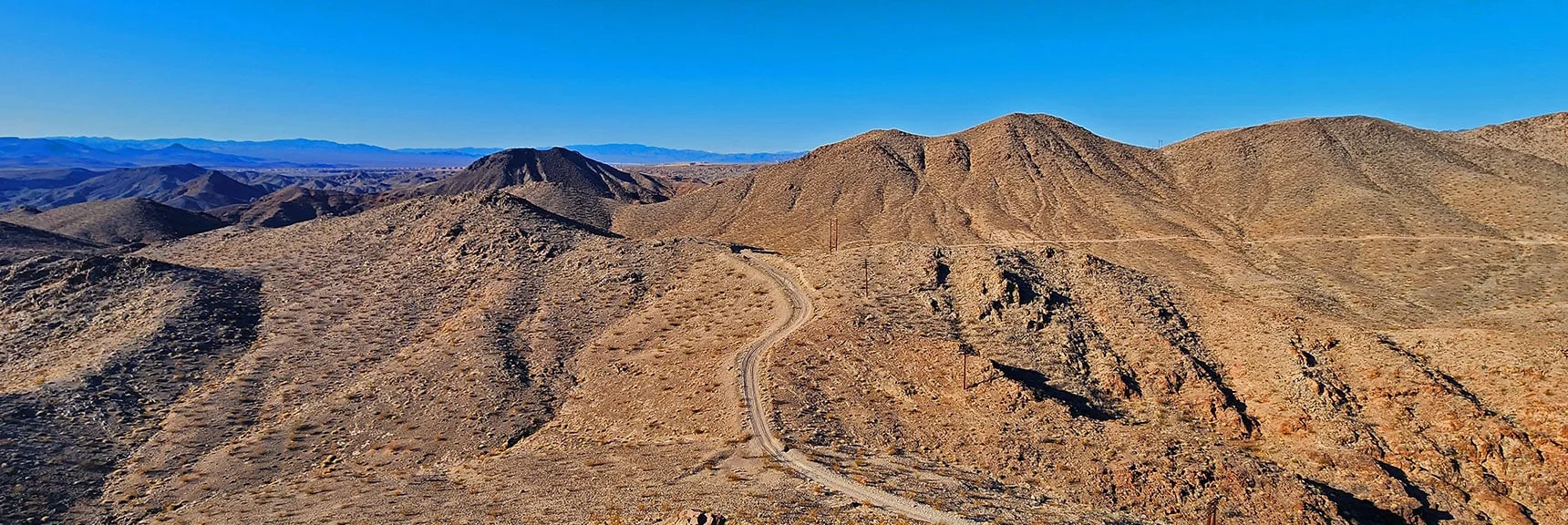 View Back to curve in Black Canyon Overlook Rd. & Windbreak Peak | Black Canyon Overlook Loop | Lake Mead NRA, Nevada