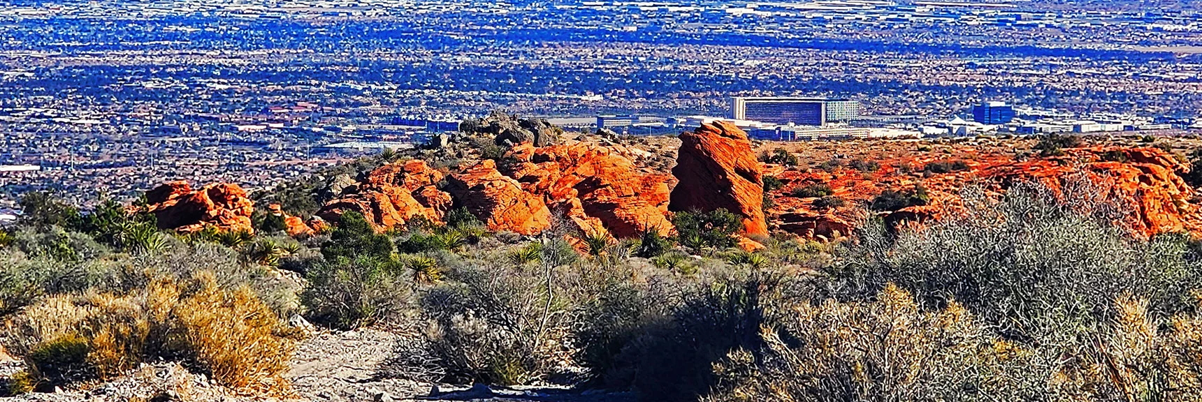 Descend to Little Red Rock. Red Rock Casino & Vegas Valley in Background. | Damsel Peak End-To-End | Brownstone Basin, Nevada